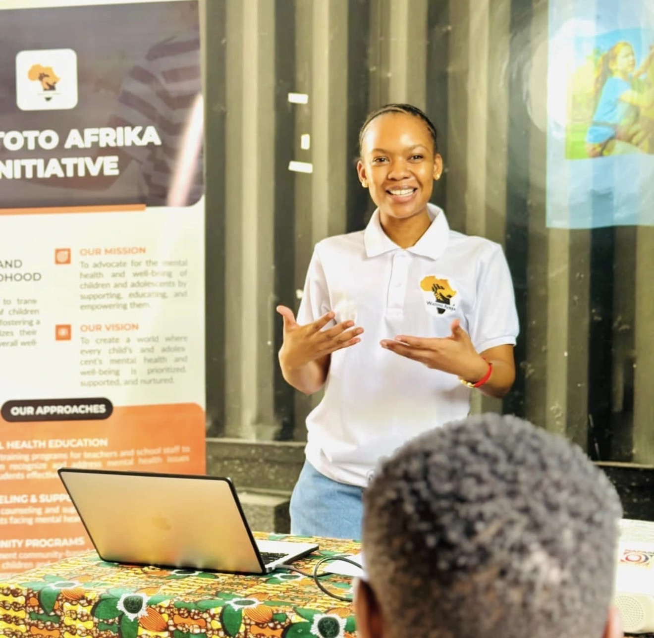 Watoto Afrika founder addressing a community gathering